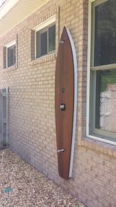 A canoe to hide the plumbing on an outside shower